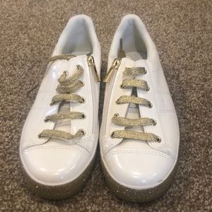 White shoes with gold sparkle details